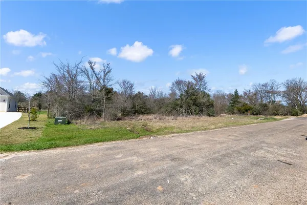 a view of a house with a big yard