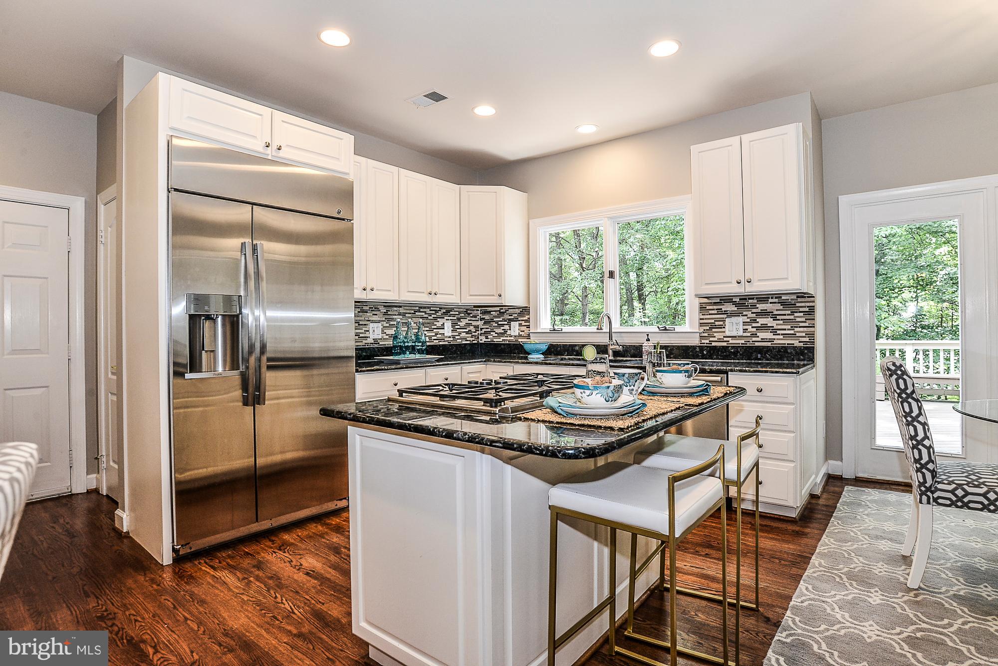 1309 Stamford Way Reston, VA 20194 - Photo 10 of 50 Gourmet Kitchen with Granite & Custom Backsplash