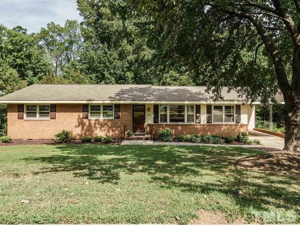 4305 Rowan Street Raleigh, NC 27609 - Photo 1 of 22 a front view of a house with a garden