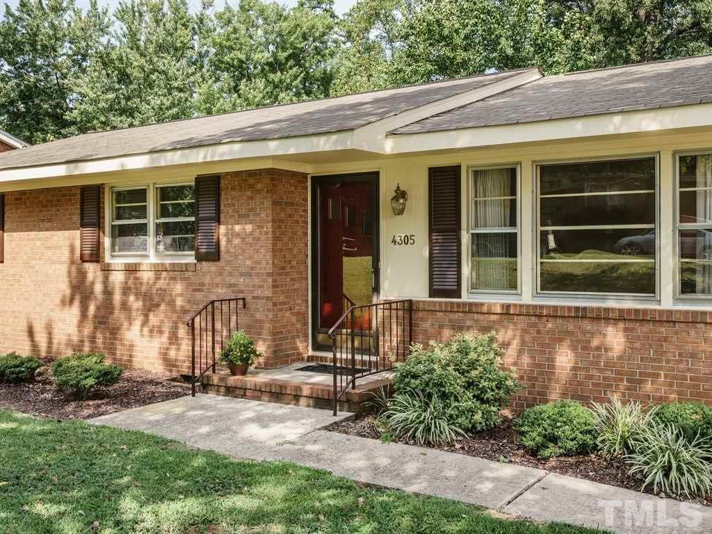 4305 Rowan Street Raleigh, NC 27609 - Photo 2 of 22 front view of a house with a yard