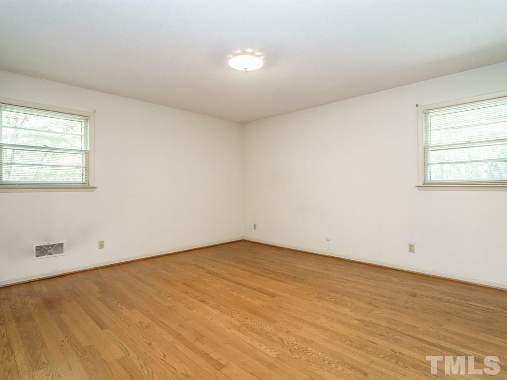 4305 Rowan Street Raleigh, NC 27609 - Photo 12 of 22 an empty room with a window