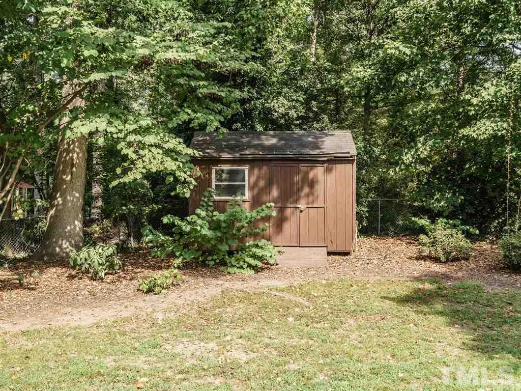 4305 Rowan Street Raleigh, NC 27609 - Photo 20 of 22 a house with trees in front of it