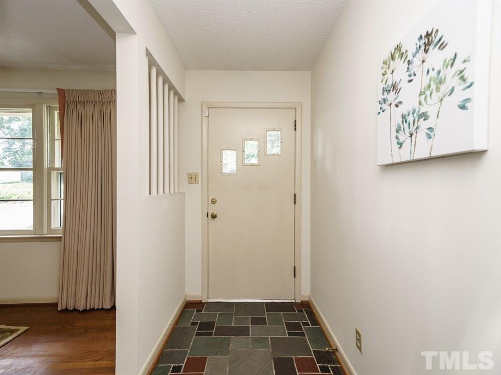 4305 Rowan Street Raleigh, NC 27609 - Photo 3 of 22 an empty room with windows and closet