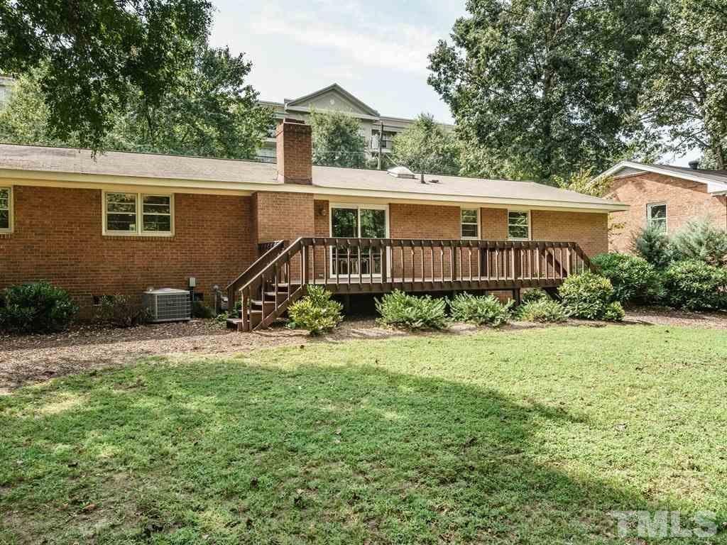4305 Rowan Street Raleigh, NC 27609 - Photo 21 of 22 a view of a house with backyard and sitting area
