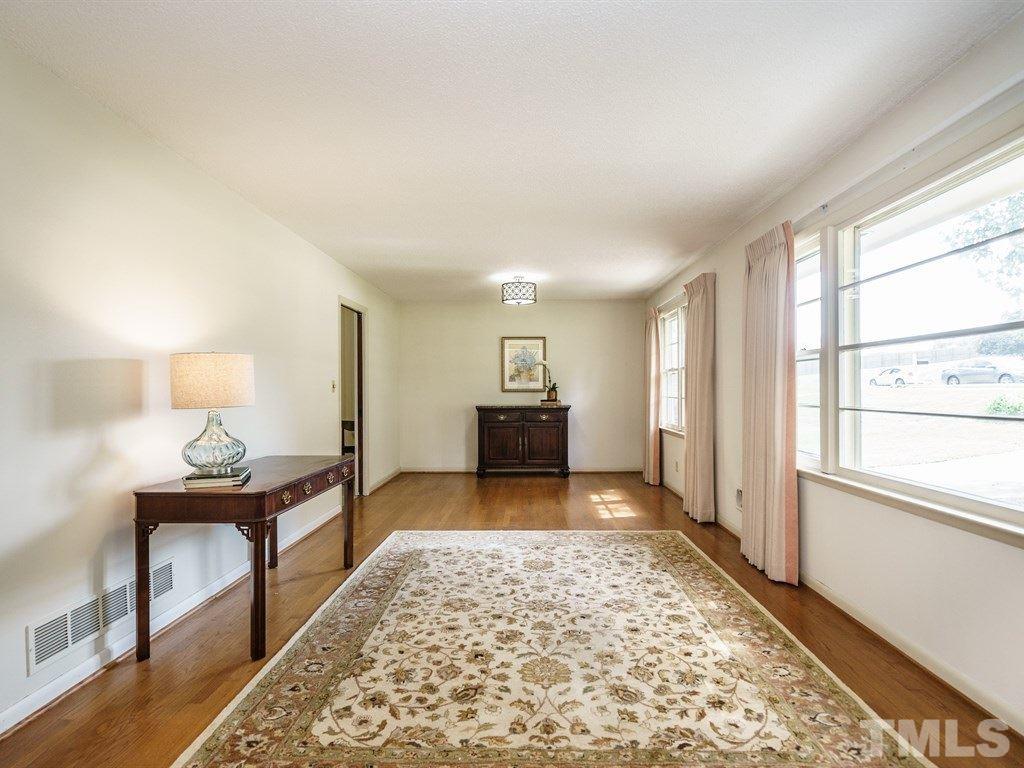 4305 Rowan Street Raleigh, NC 27609 - Photo 4 of 22 a living room with furniture and a rug