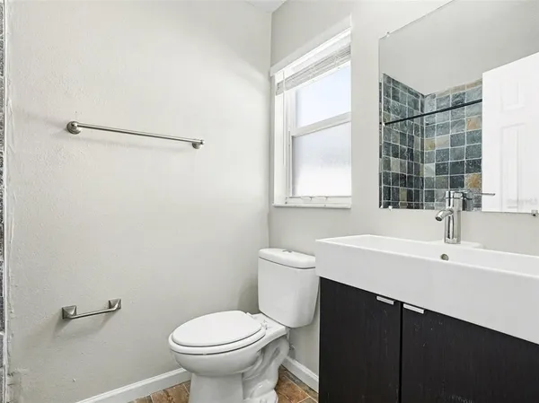 a bathroom with a sink and a toilet