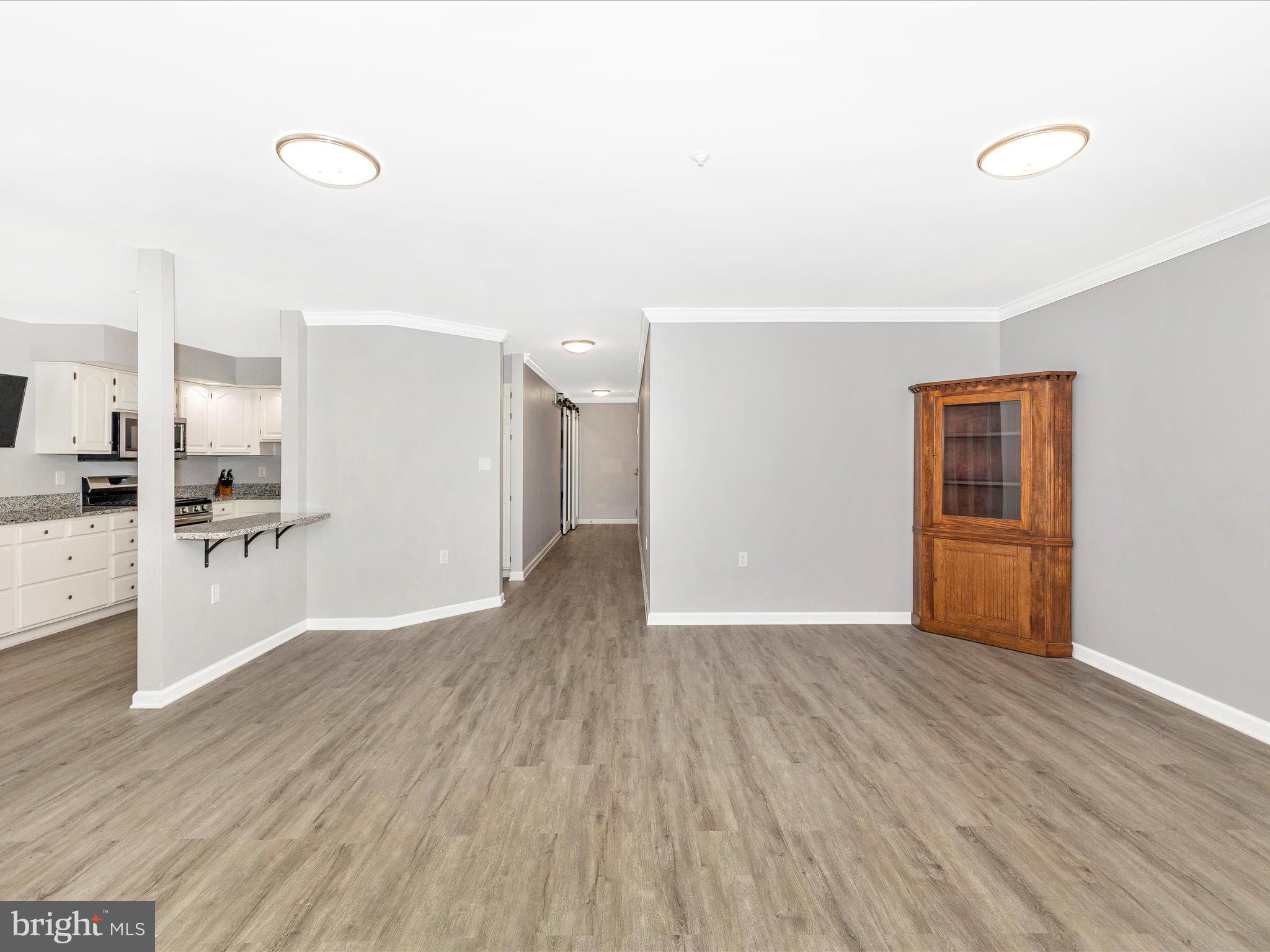 102 Mercer Court, Unit 22 1A Frederick, MD 21701 - Photo 11 of 56 a view of a kitchen with wooden floor