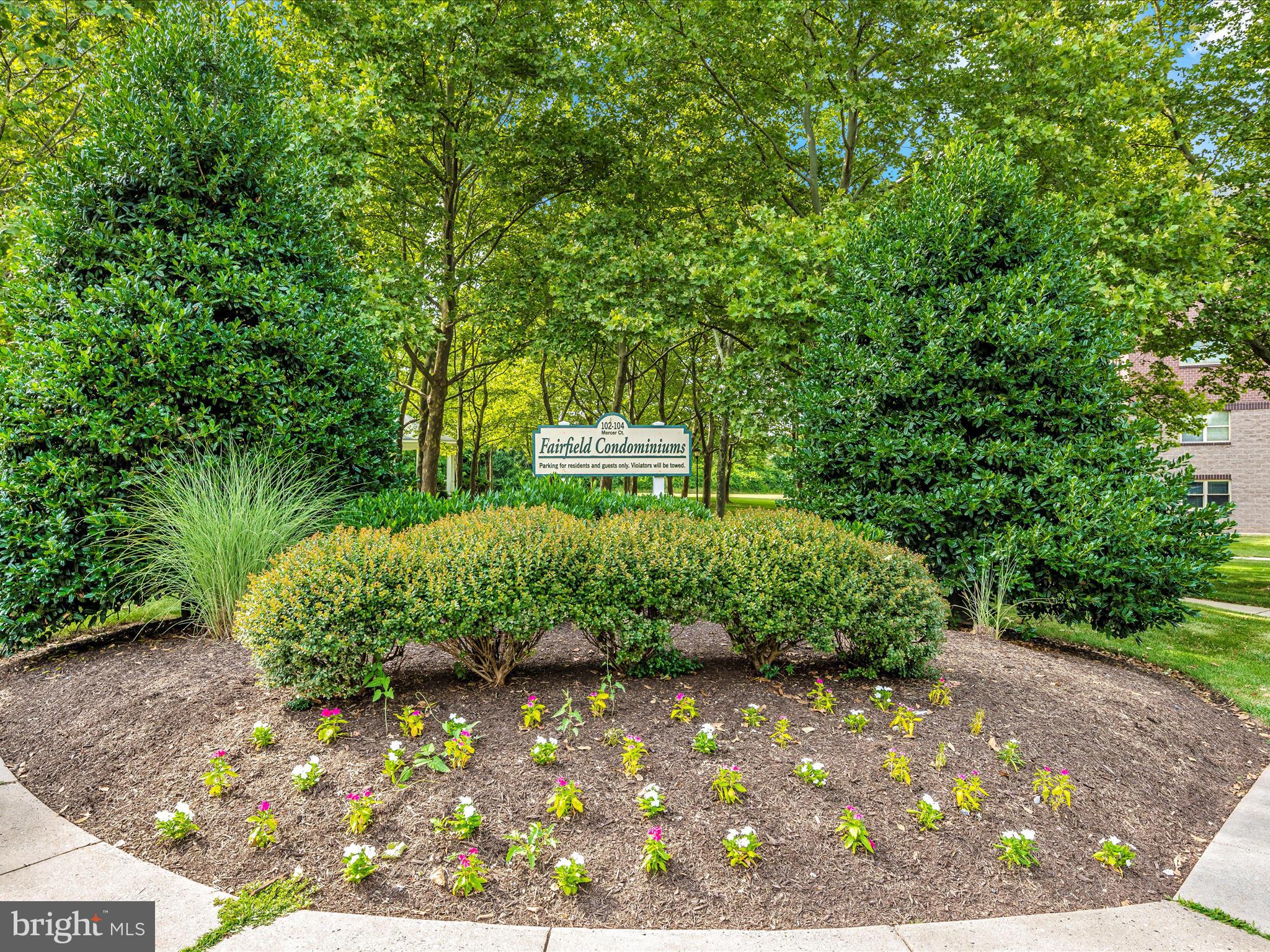 102 Mercer Court, Unit 22 1A Frederick, MD 21701 - Photo 2 of 56 a view of a garden with a bench