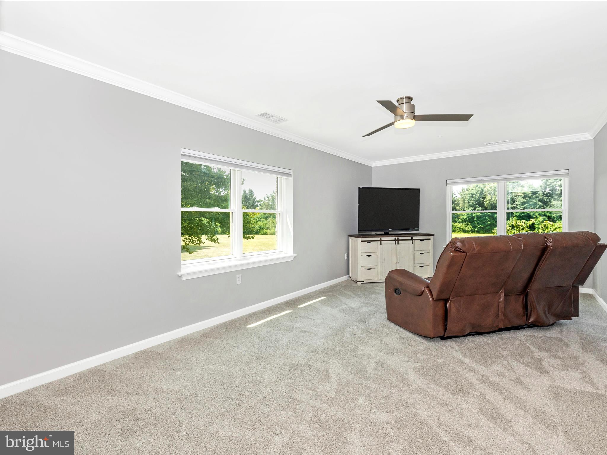 102 Mercer Court, Unit 22 1A Frederick, MD 21701 - Photo 27 of 56 a living room with furniture and a flat screen tv