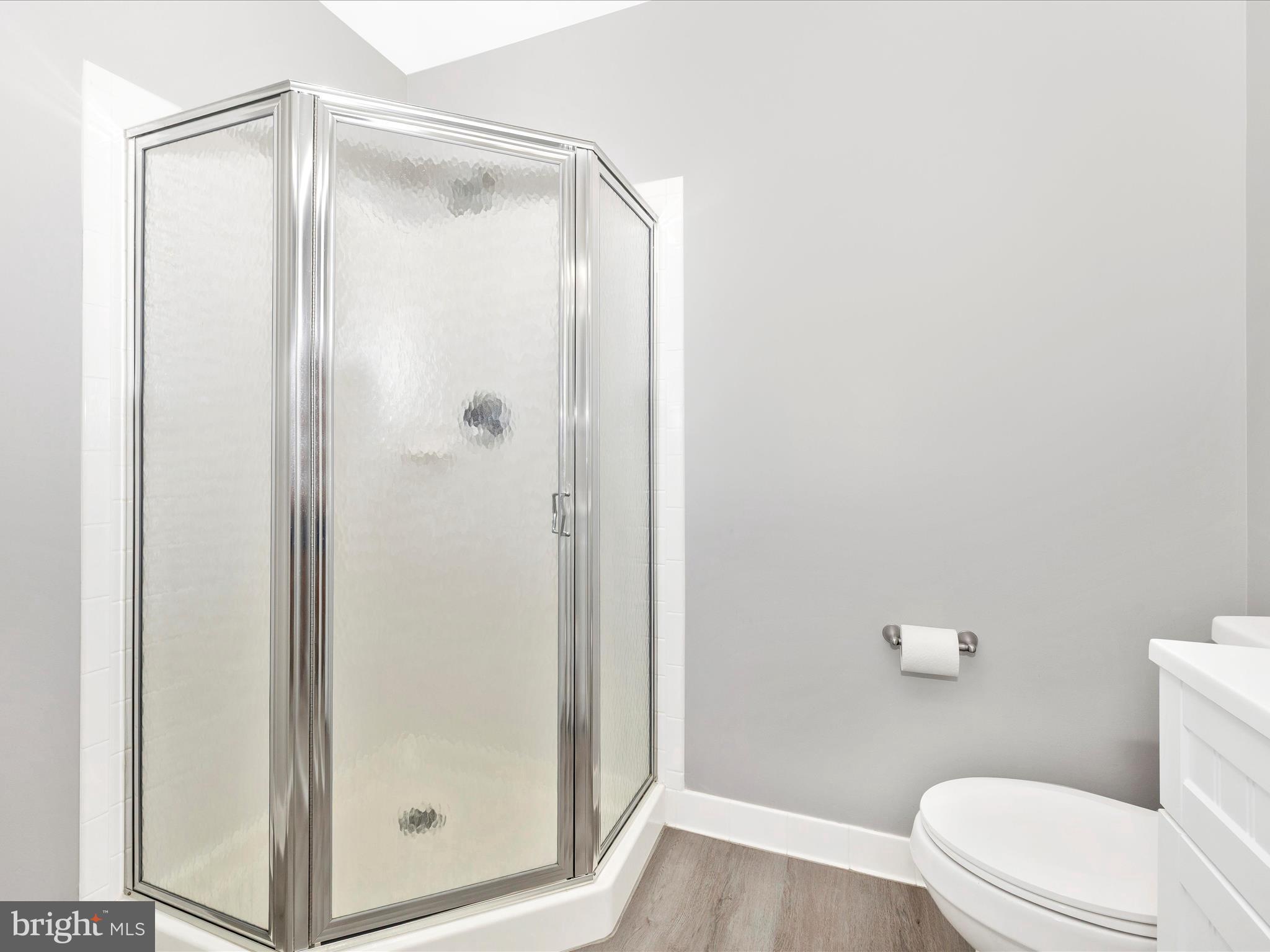 102 Mercer Court, Unit 22 1A Frederick, MD 21701 - Photo 30 of 56 a bathroom with a glass shower door