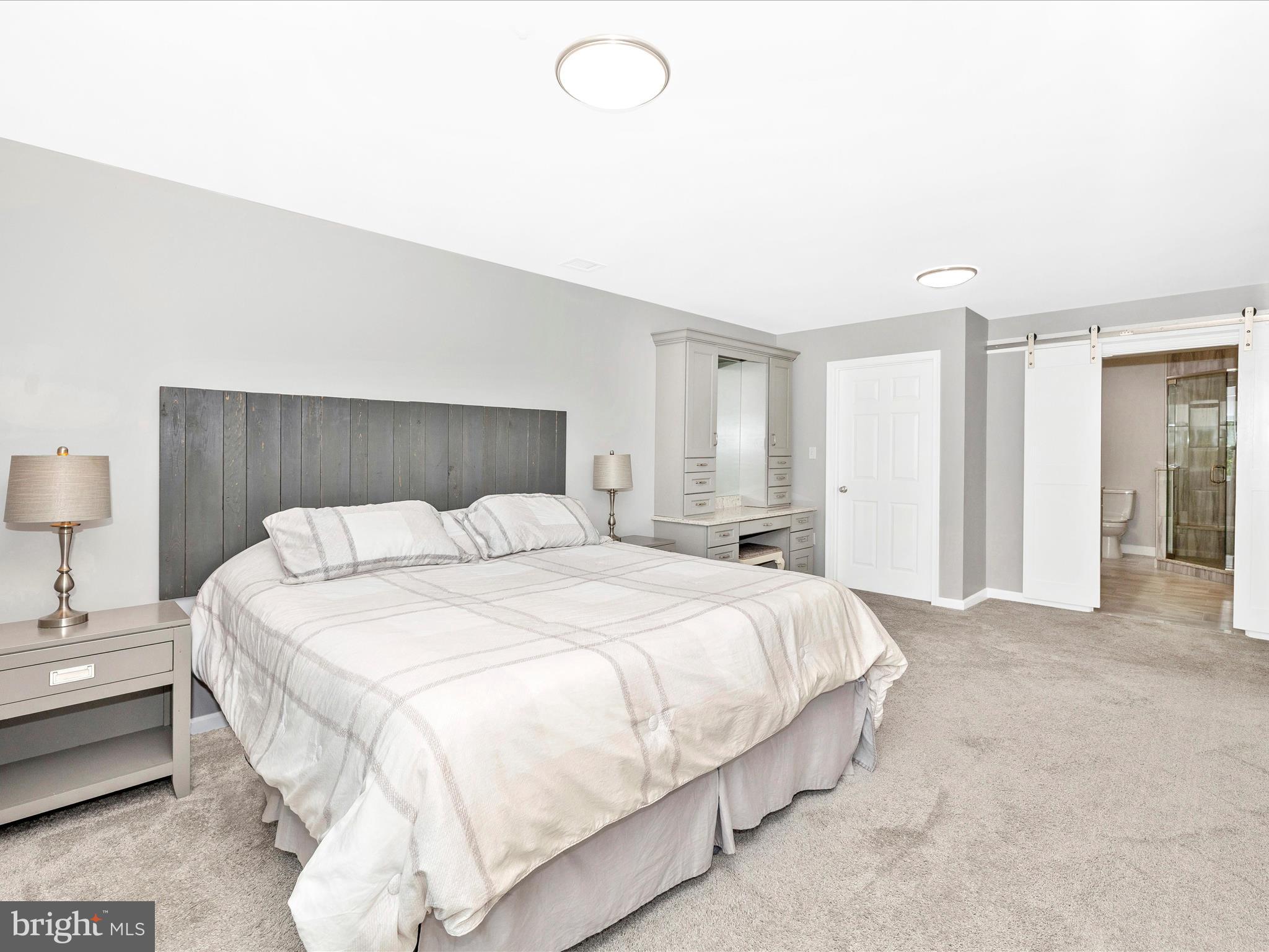 102 Mercer Court, Unit 22 1A Frederick, MD 21701 - Photo 33 of 56 a large white bed in a white room