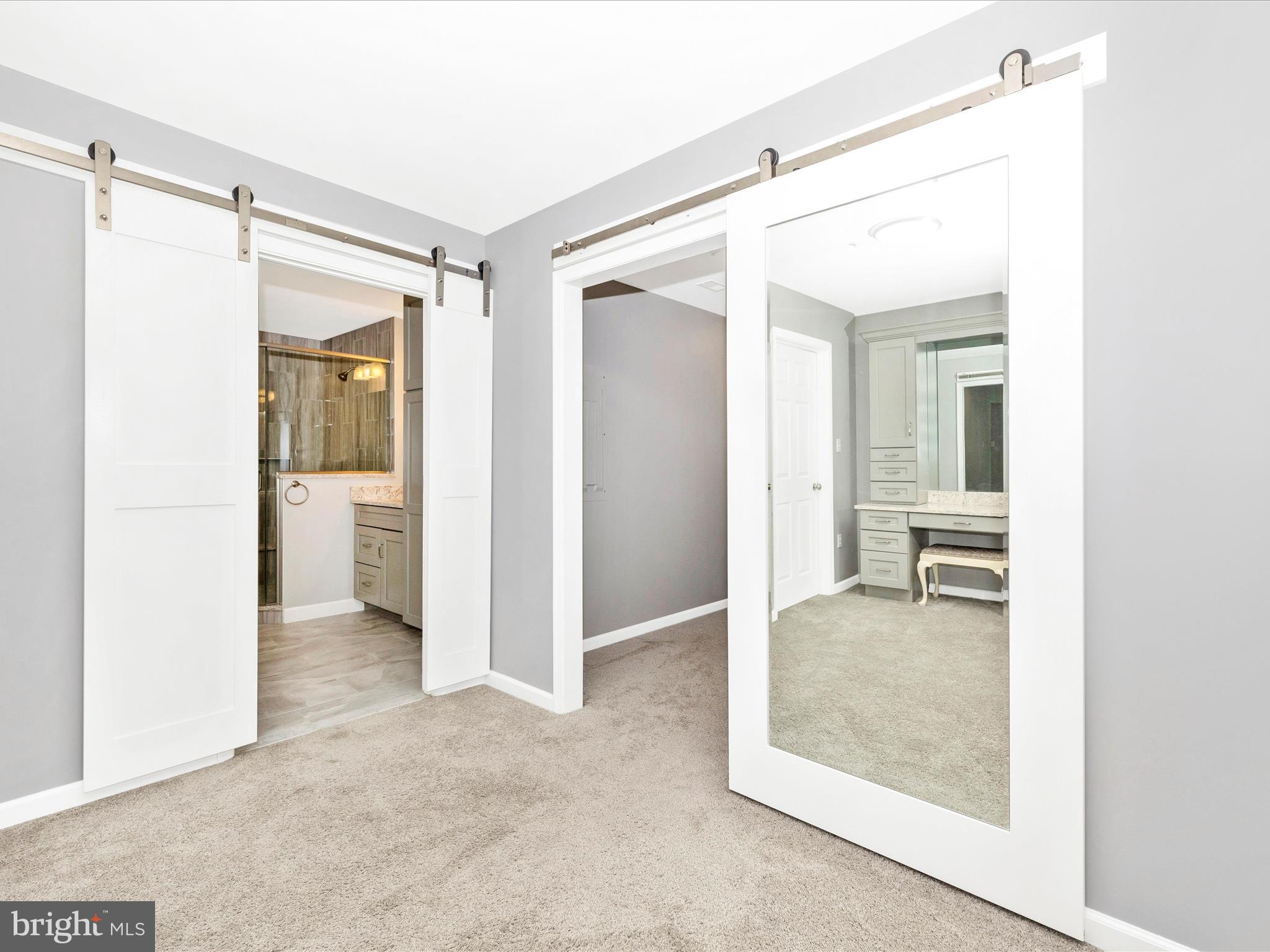 102 Mercer Court, Unit 22 1A Frederick, MD 21701 - Photo 35 of 56 a view of a hallway with wooden floor and a kitchen