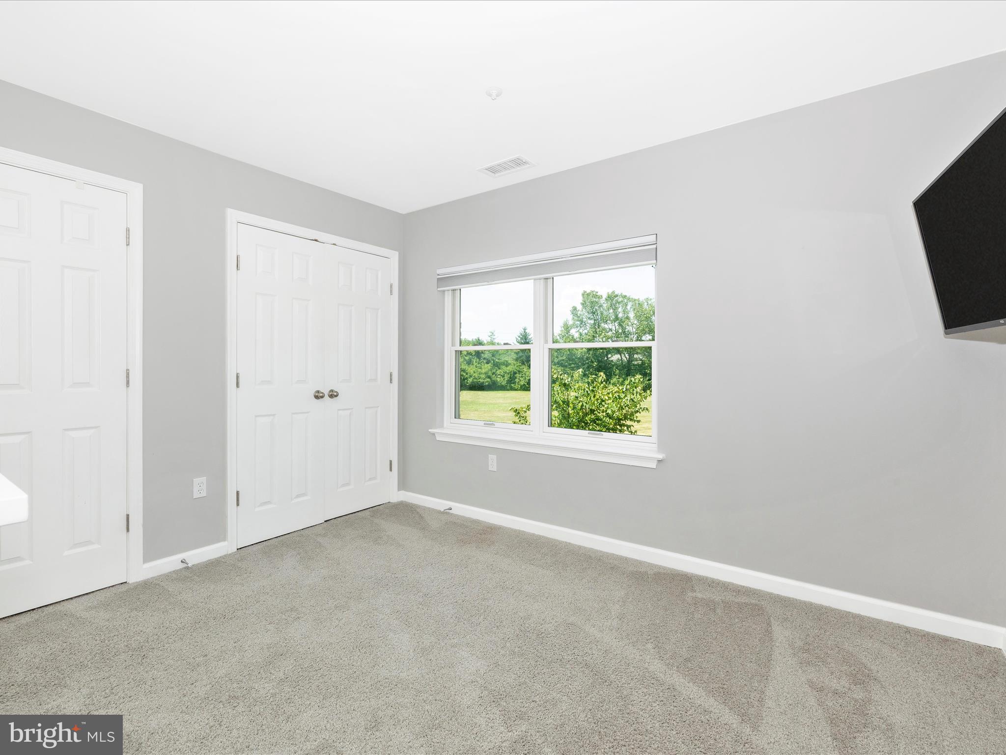 102 Mercer Court, Unit 22 1A Frederick, MD 21701 - Photo 41 of 56 an empty room with a window