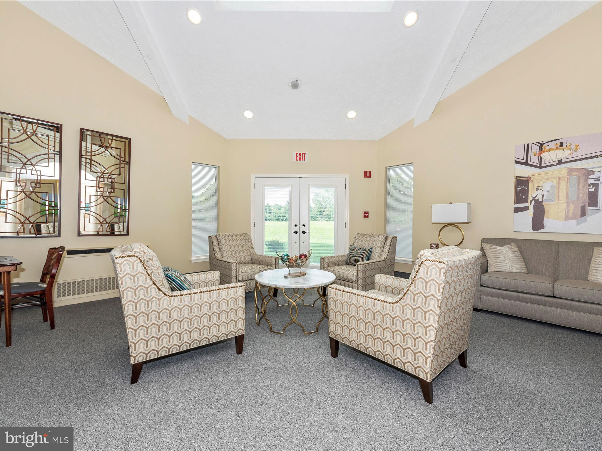 102 Mercer Court, Unit 22 1A Frederick, MD 21701 - Photo 7 of 56 a living room with furniture and a large window