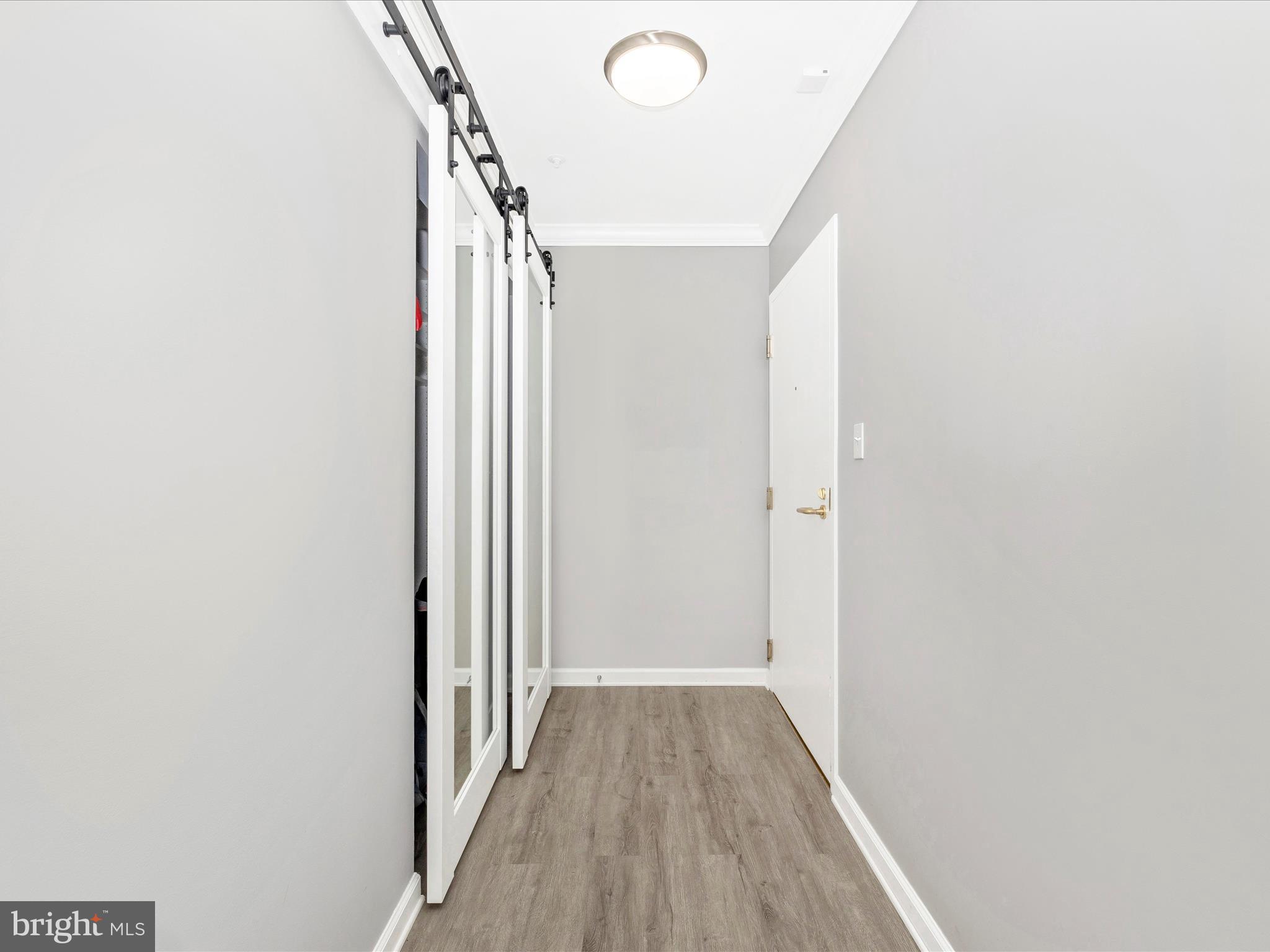 102 Mercer Court, Unit 22 1A Frederick, MD 21701 - Photo 10 of 56 a view of a hallway with wooden floor