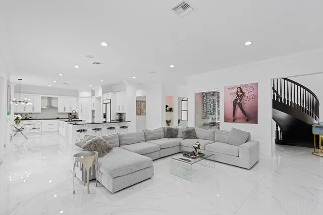 a living room with furniture and a painting