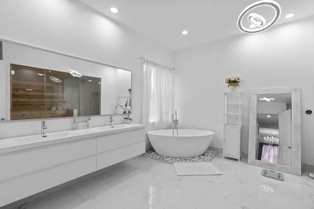 a bathroom with a tub and a sink