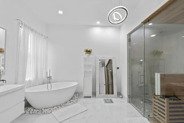 a bathroom with a bathtub and a shower