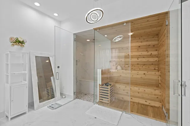a bathroom with a shower and a mirror