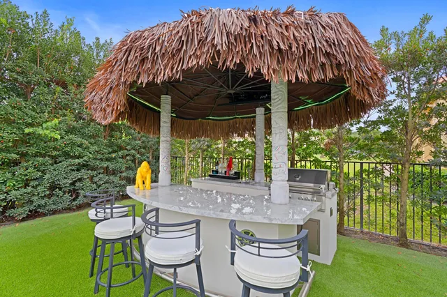 a view of an outdoor sitting area with furniture