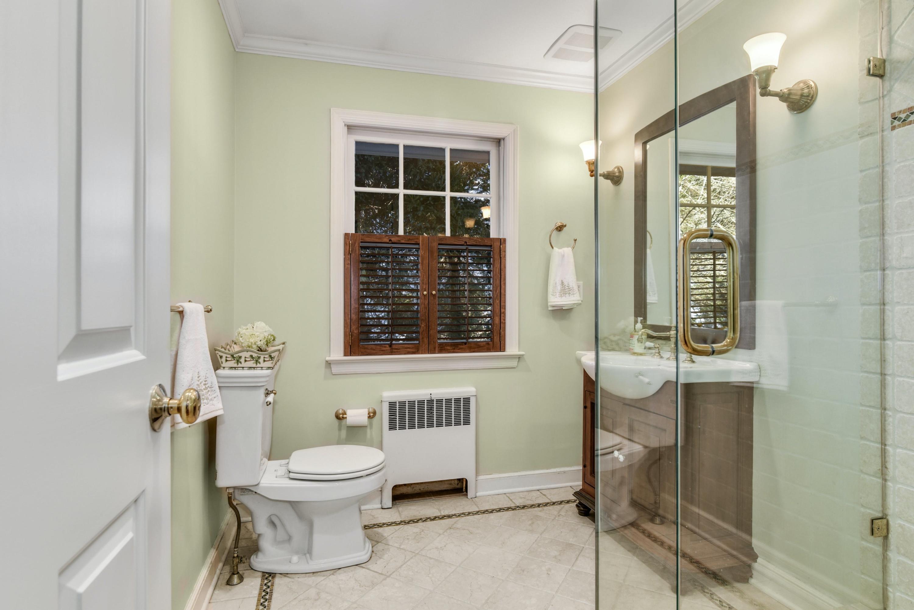 11 Sunset Road Darien, CT 06820 - Photo 12 of 38 a bathroom with a toilet a sink and a mirror