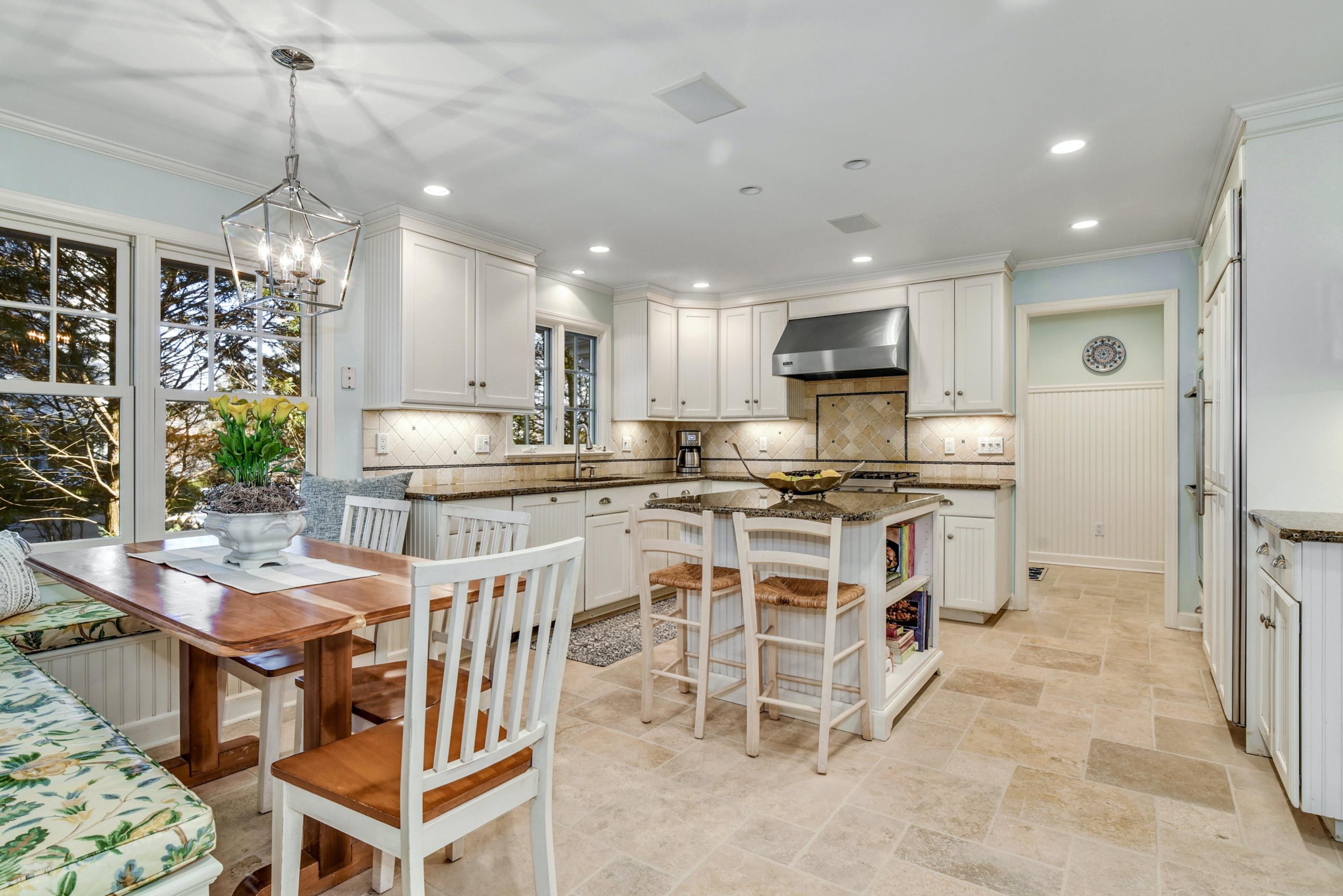 11 Sunset Road Darien, CT 06820 - Photo 13 of 38 a kitchen with stainless steel appliances kitchen island granite countertop a sink and a refrigerator