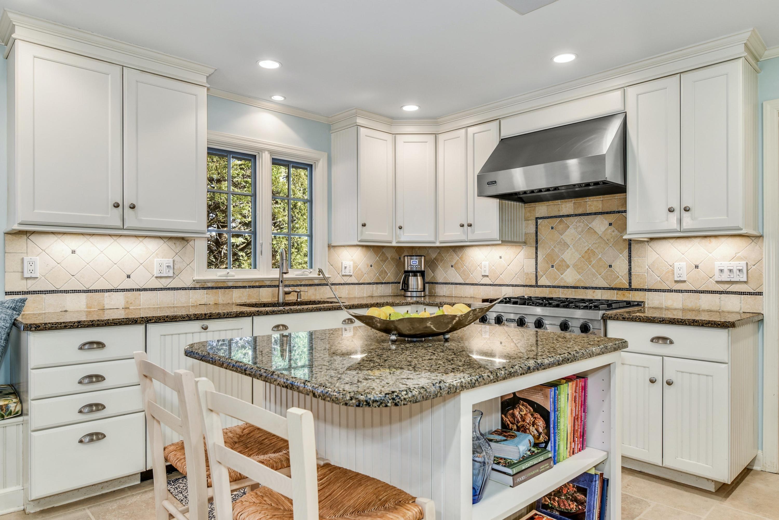 11 Sunset Road Darien, CT 06820 - Photo 14 of 38 a kitchen with granite countertop a sink a stove and cabinets