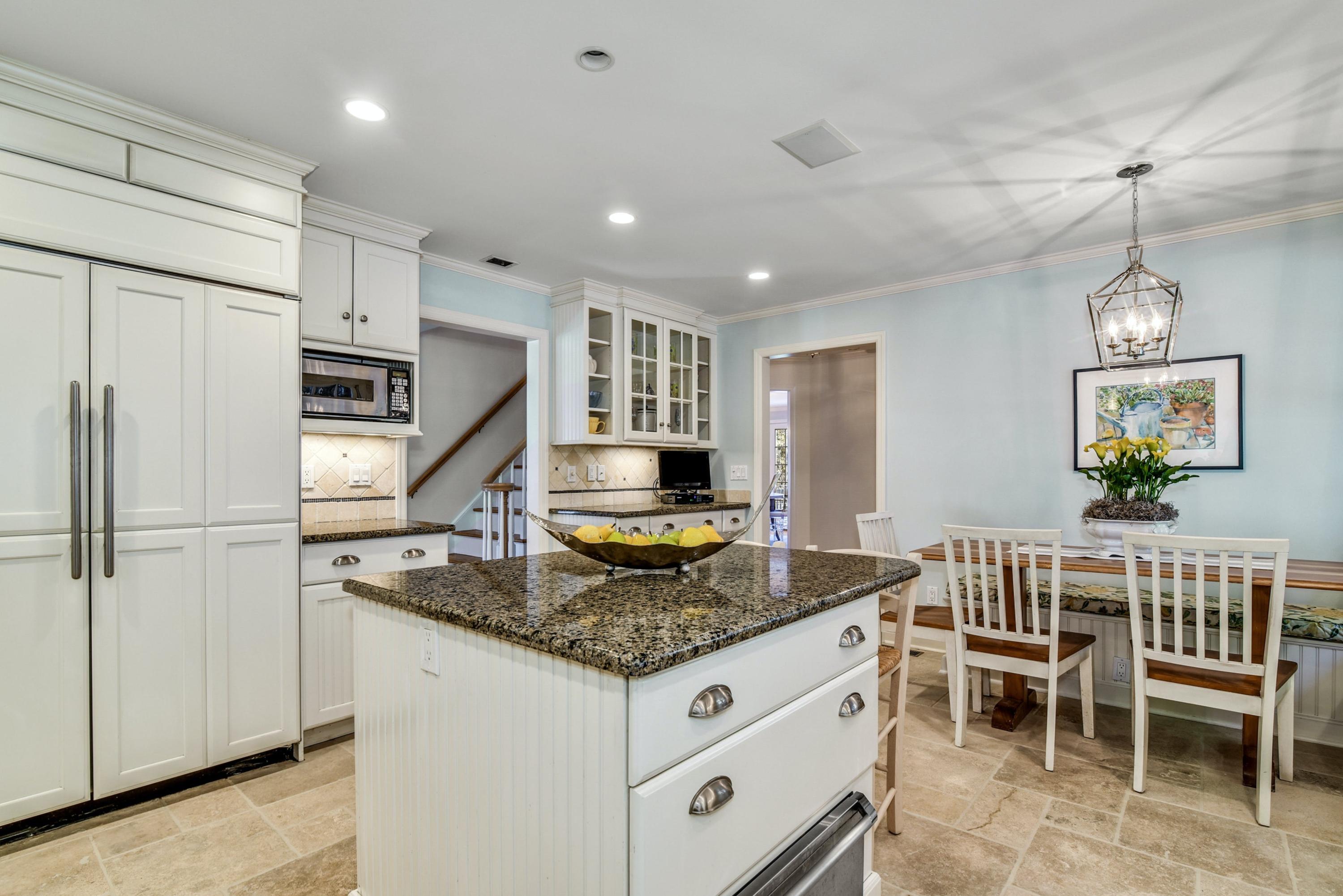 11 Sunset Road Darien, CT 06820 - Photo 16 of 38 a kitchen with sink cabinets and refrigerator