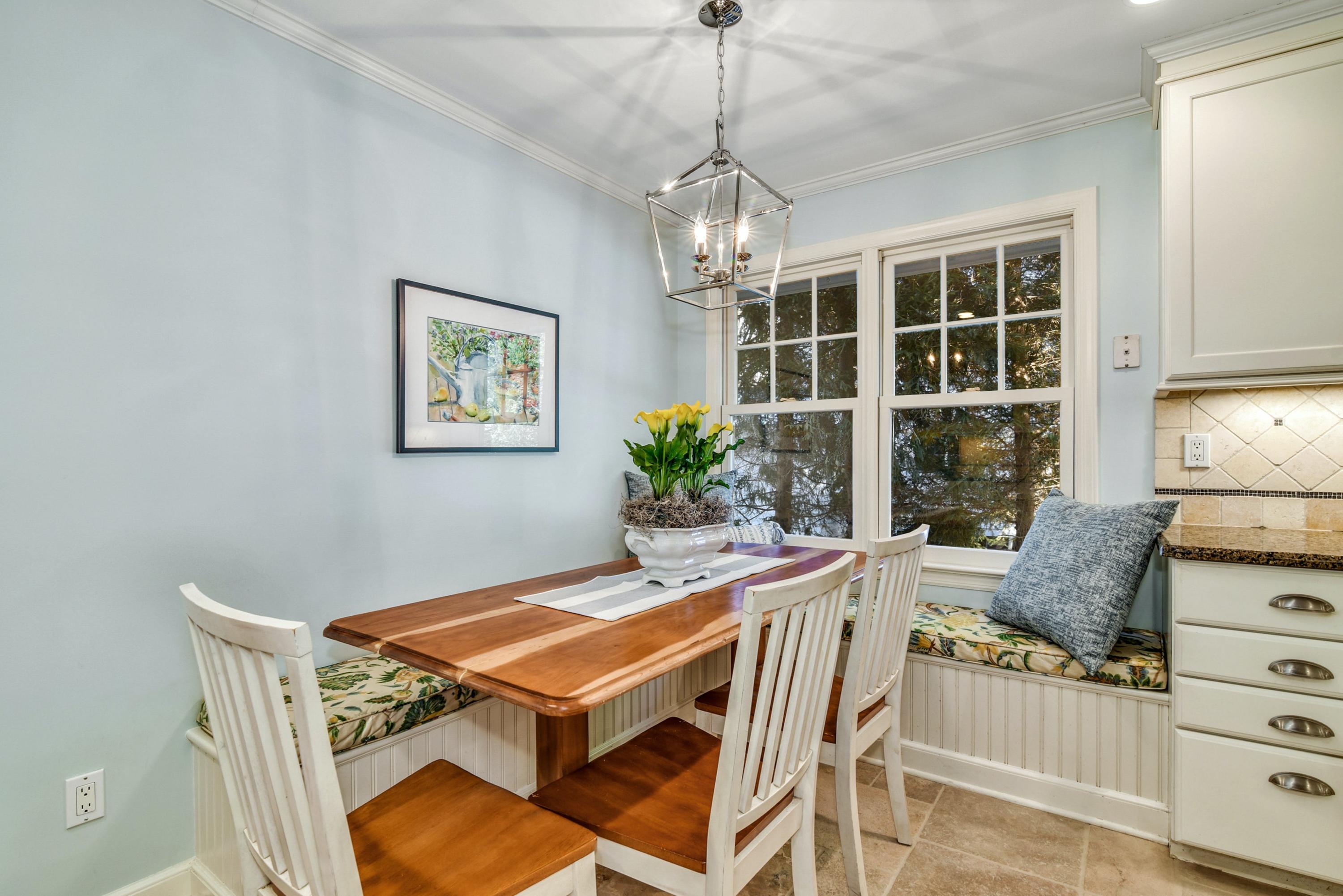11 Sunset Road Darien, CT 06820 - Photo 17 of 38 a living room with a table chairs and a window