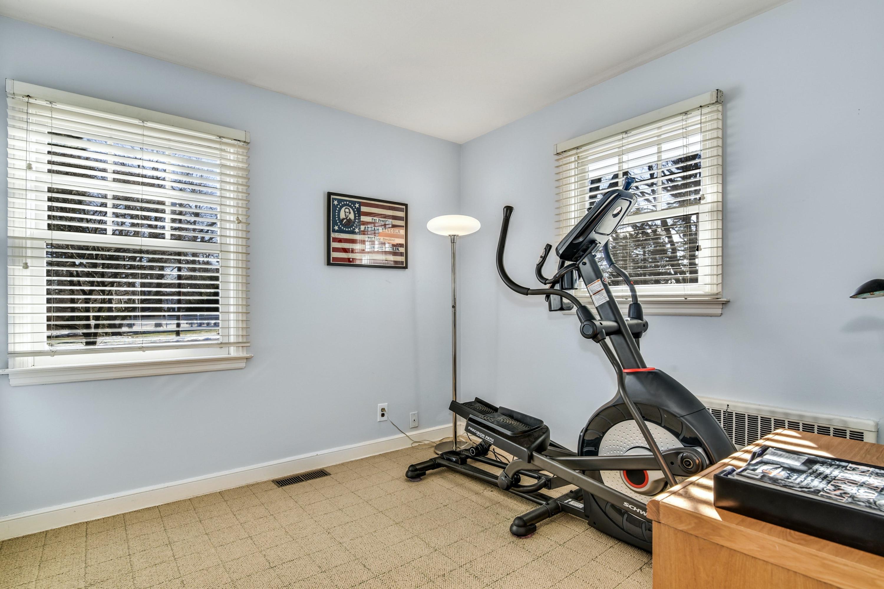 11 Sunset Road Darien, CT 06820 - Photo 19 of 38 a room with gym equipment and windows