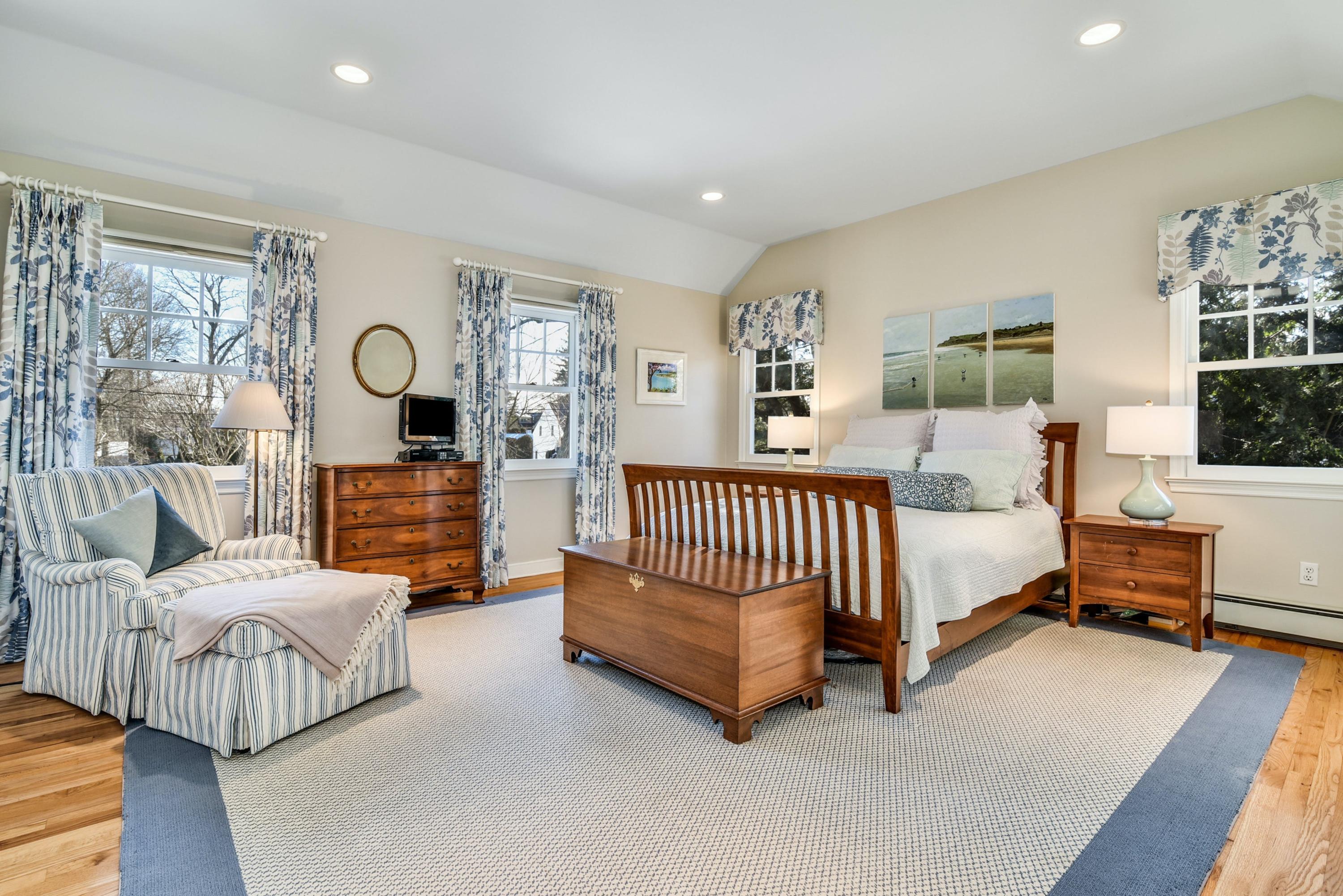 11 Sunset Road Darien, CT 06820 - Photo 22 of 38 a bedroom with furniture and a large window