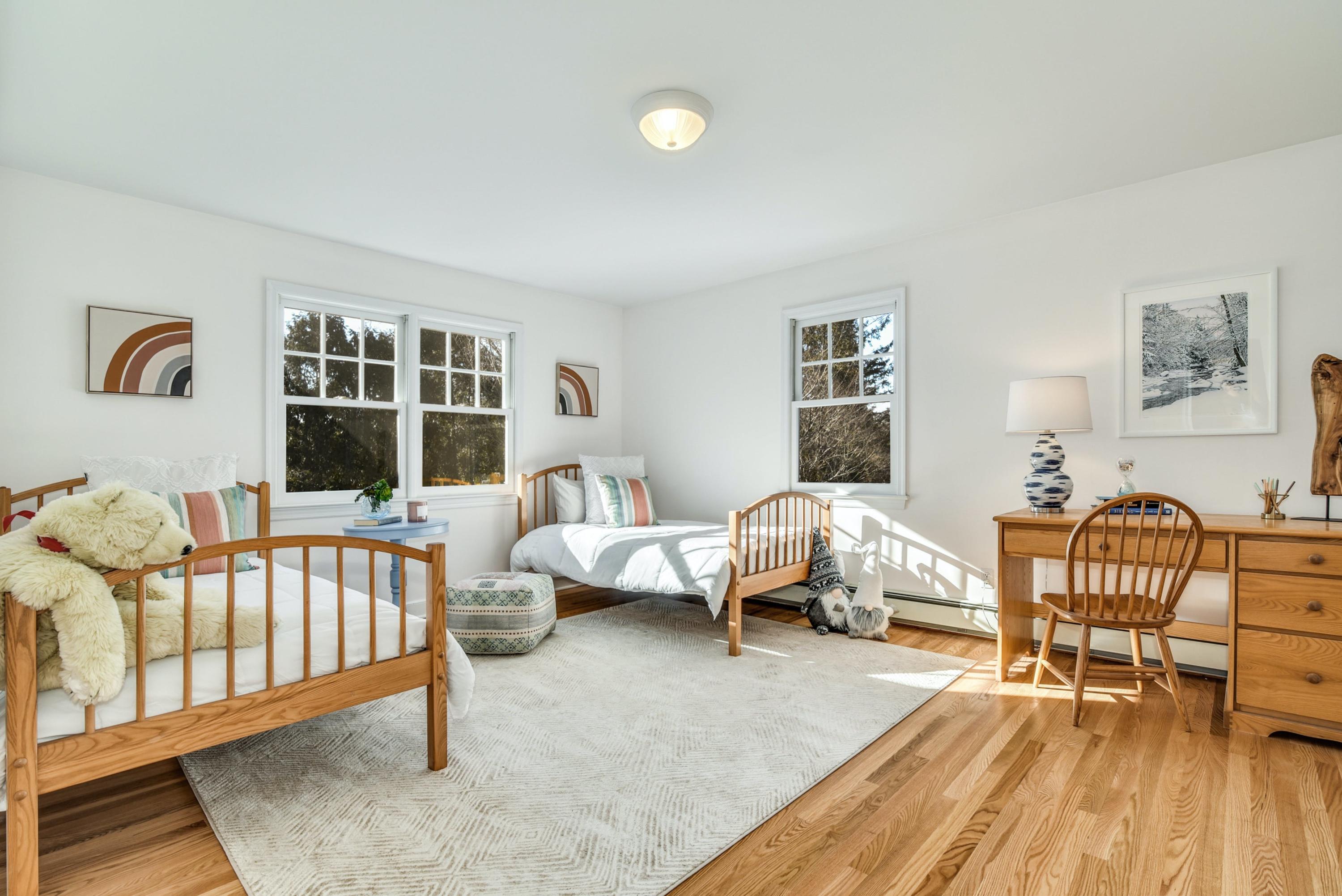 11 Sunset Road Darien, CT 06820 - Photo 26 of 38 a bedroom with furniture and a window