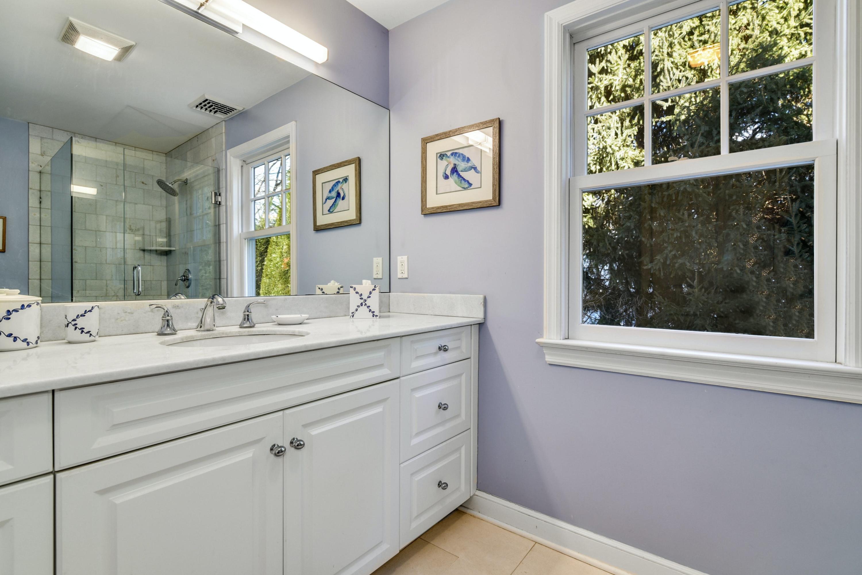 11 Sunset Road Darien, CT 06820 - Photo 29 of 38 a bathroom with a sink and a mirror