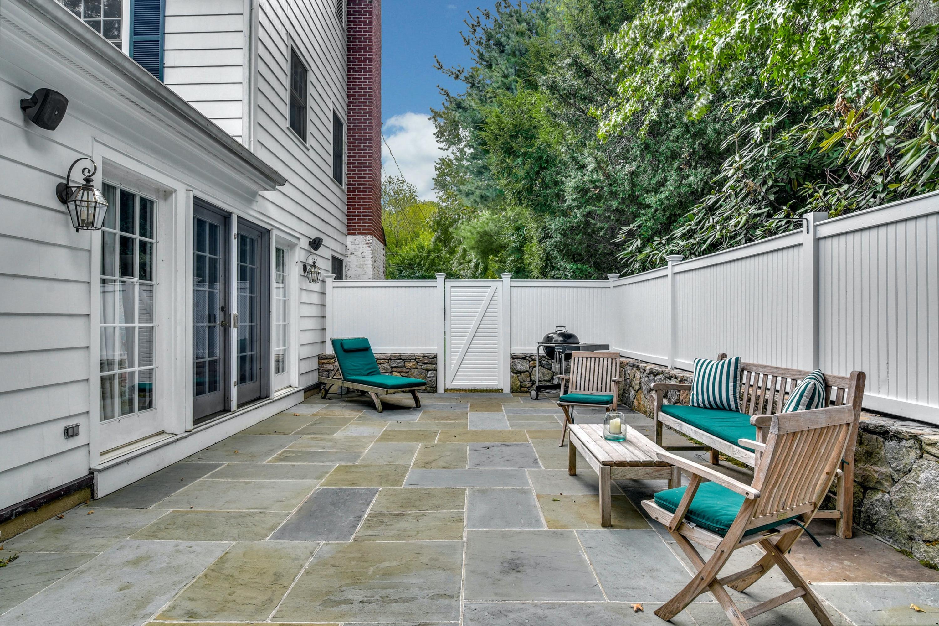 11 Sunset Road Darien, CT 06820 - Photo 32 of 38 a view of a patio with couple of chairs and a fire pit