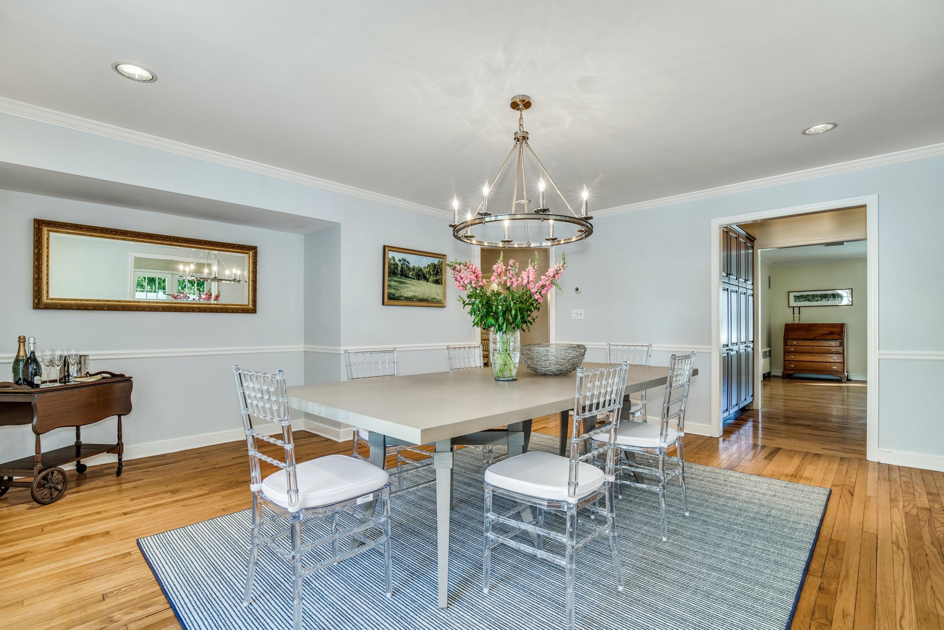 11 Sunset Road Darien, CT 06820 - Photo 8 of 38 a view of a dining room with furniture wooden floor and a chandelier