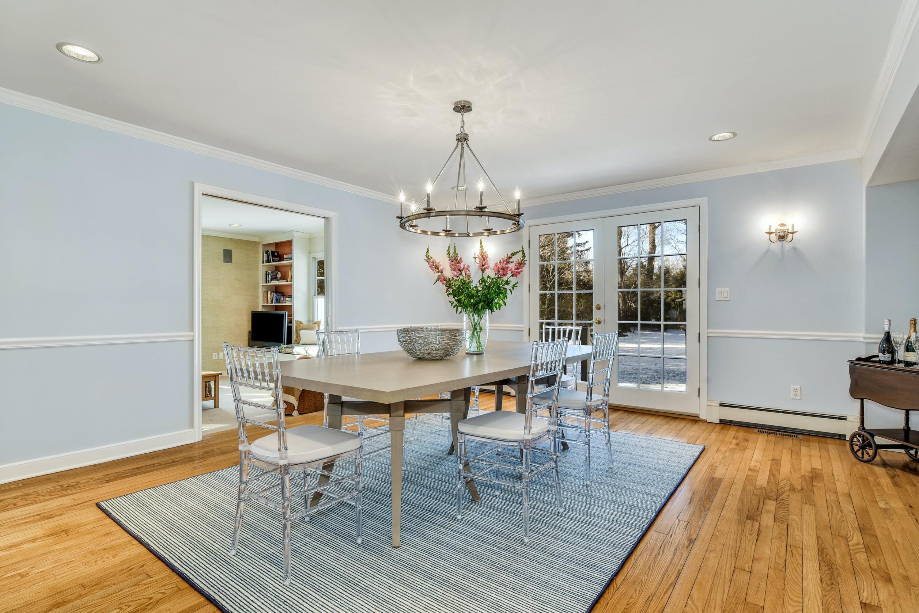 11 Sunset Road Darien, CT 06820 - Photo 9 of 38 a view of a dining room with furniture wooden floor and a chandelier