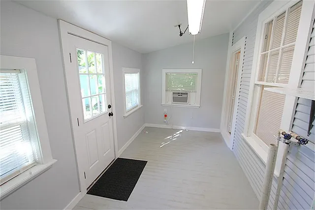 a view of an empty room with a window