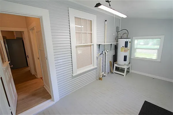 a view of kitchen with furniture and a window