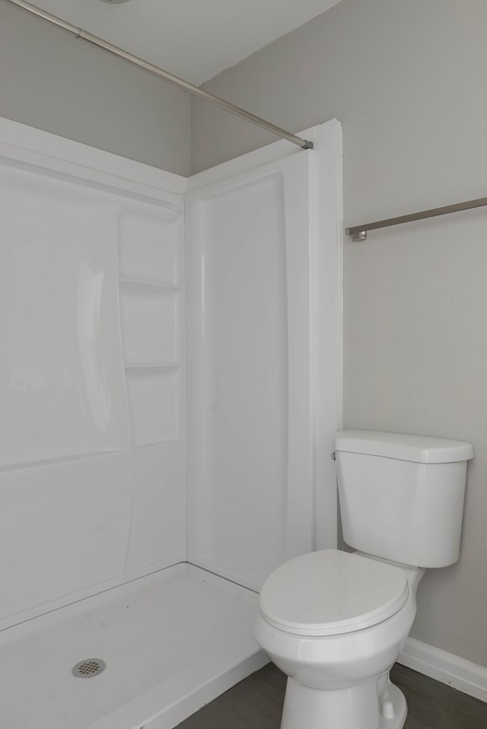 3221 Walker Street Columbus, GA 31903 - Photo 11 of 18 a white toilet sitting next to a bath tub