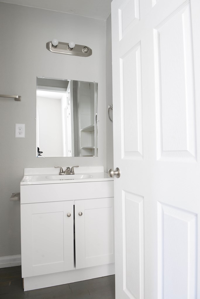 3221 Walker Street Columbus, GA 31903 - Photo 13 of 18 a bathroom with a sink and a mirror