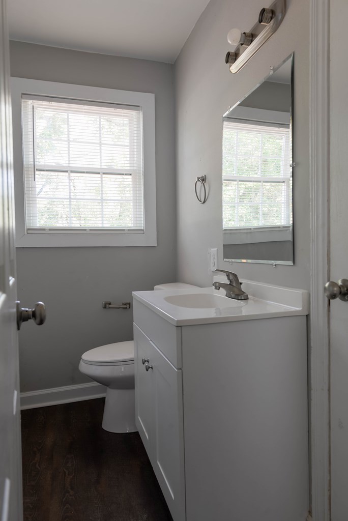 3221 Walker Street Columbus, GA 31903 - Photo 16 of 18 a bathroom with a sink toilet and window