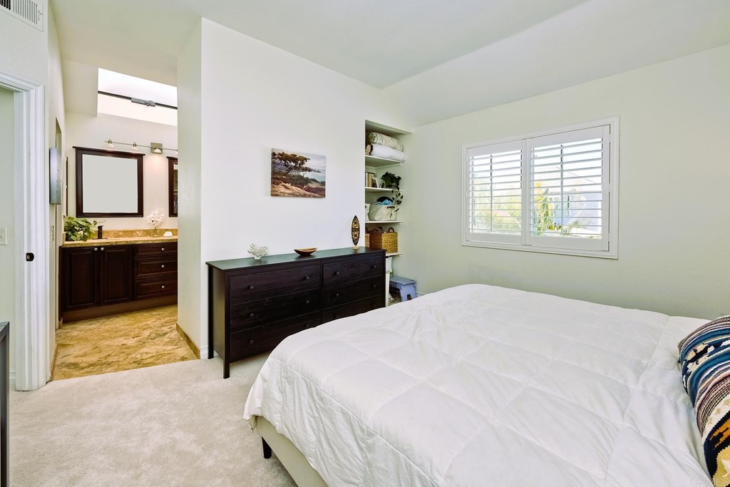 821 Windcrest Drive Carlsbad, CA 92011 - Photo 26 of 53 a bedroom with a bed and dresser
