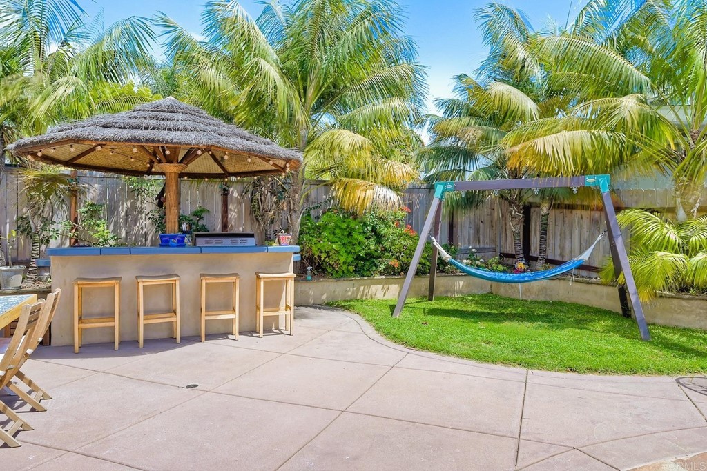 821 Windcrest Drive Carlsbad, CA 92011 - Photo 33 of 53 a view of yard with swimming pool and seating area