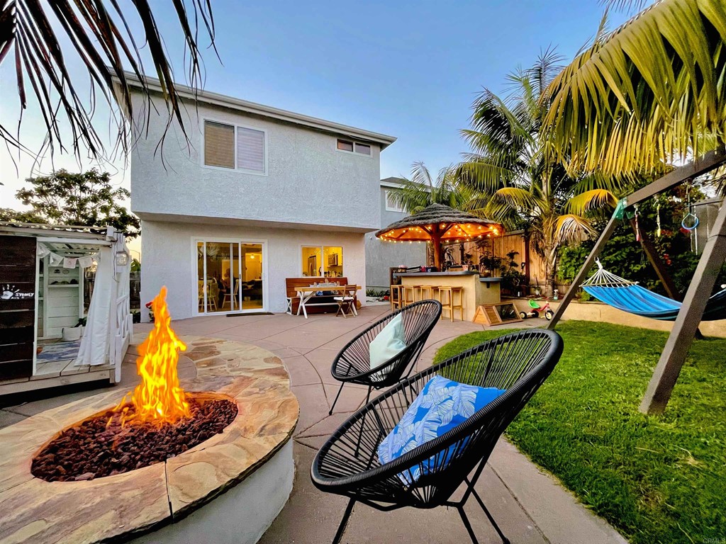 821 Windcrest Drive Carlsbad, CA 92011 - Photo 46 of 53 a view of a house with backyard water fountain and sitting area