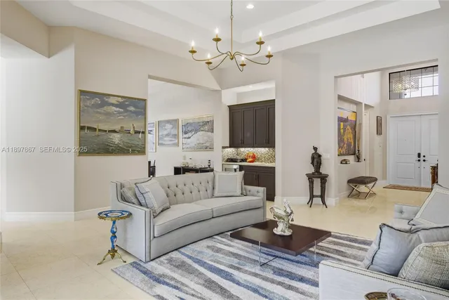 a kitchen with stainless steel appliances kitchen island granite countertop a stove a sink and a refrigerator with wooden cabinets