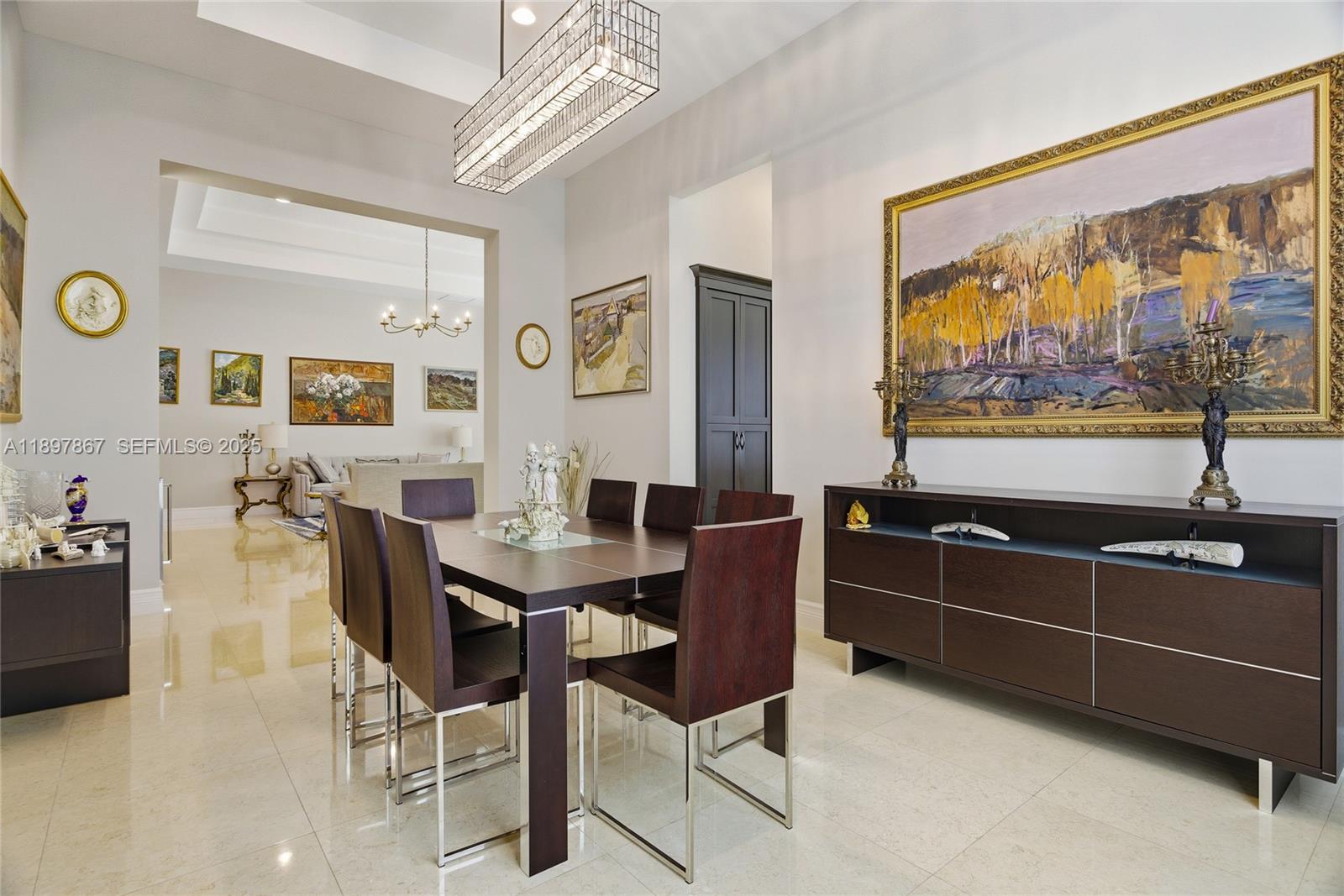 9772 Rennes Lane Delray Beach, FL 33446 - Photo 13 of 59 a view of a dining room with furniture one side kitchen view and wooden floor