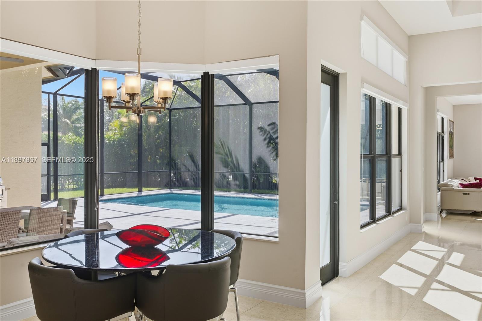 9772 Rennes Lane Delray Beach, FL 33446 - Photo 21 of 59 a living room with furniture and a floor to ceiling window