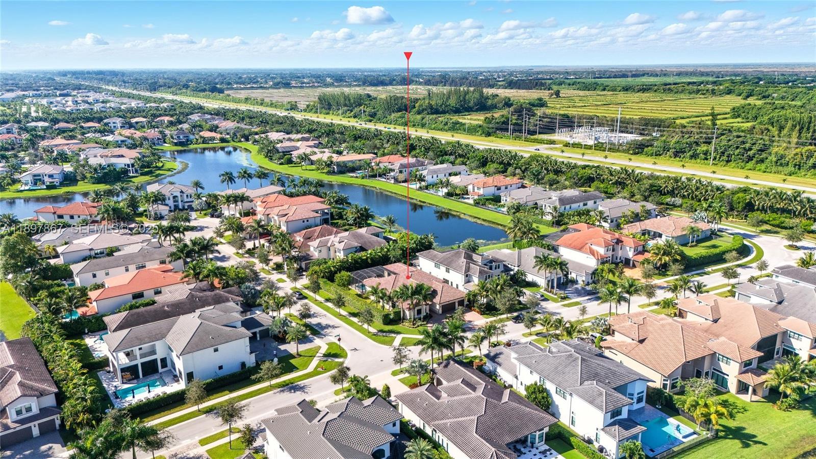 9772 Rennes Lane Delray Beach, FL 33446 - Photo 3 of 59 an aerial view of a city with lots of residential buildings ocean and mountain view in back