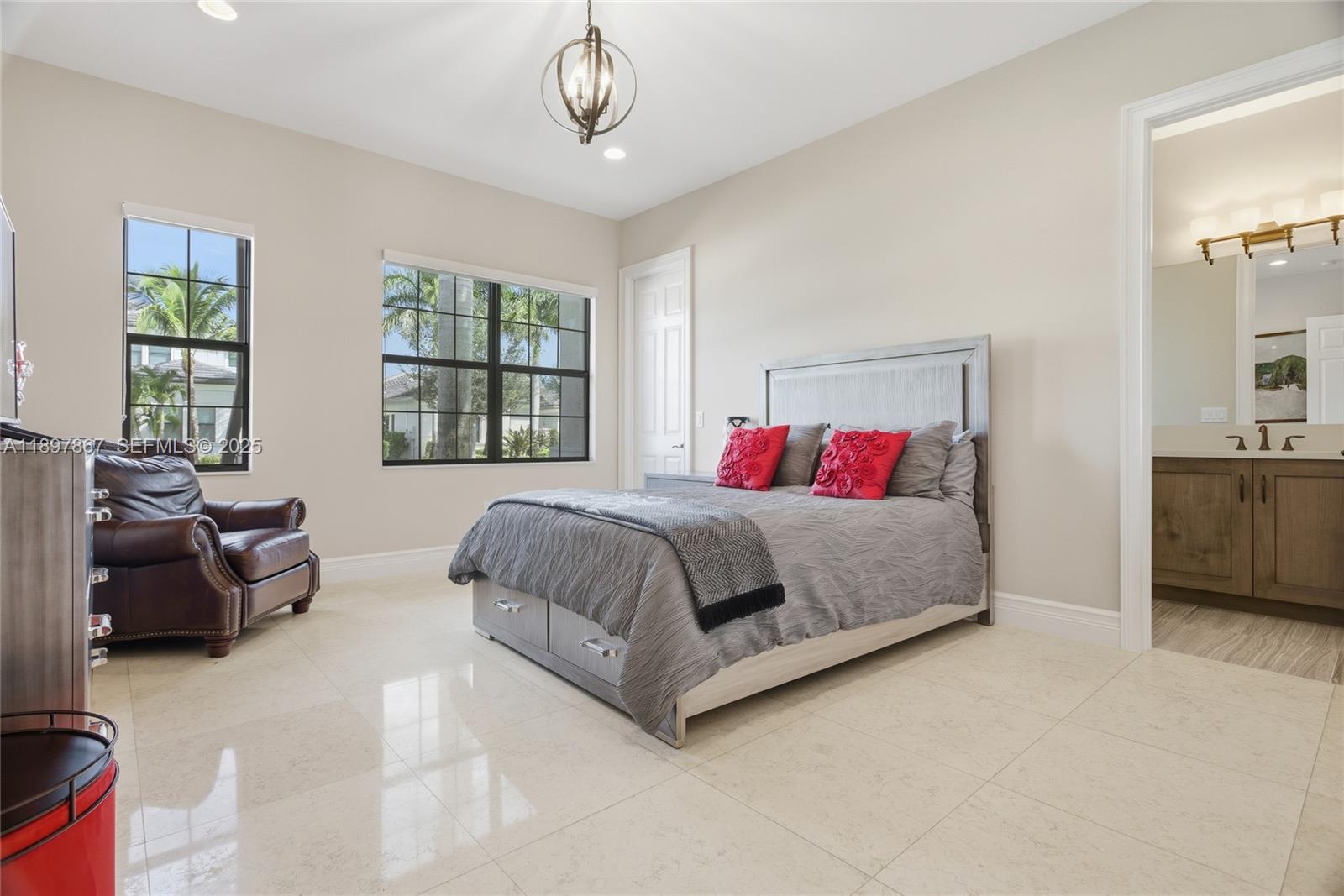 9772 Rennes Lane Delray Beach, FL 33446 - Photo 33 of 59 a spacious bedroom with a bed and a couch
