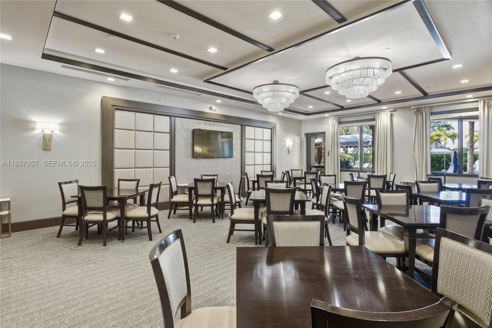 9772 Rennes Lane Delray Beach, FL 33446 - Photo 56 of 59 a dining room with lots of tables and chairs